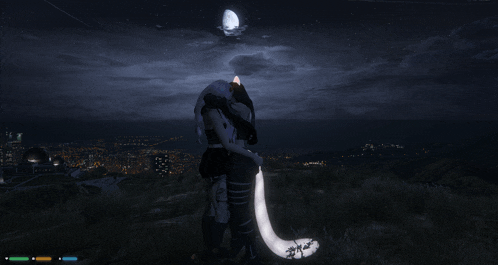 a couple standing on a hill at night with a full moon in the sky