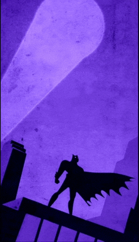 a purple background with a silhouette of batman standing on top of a building