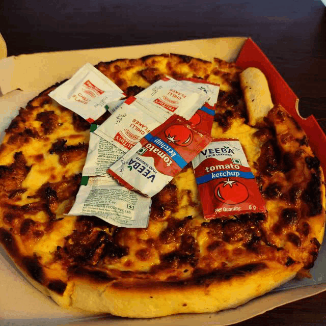 a pizza with tomato ketchup and veeba tomato ketchup