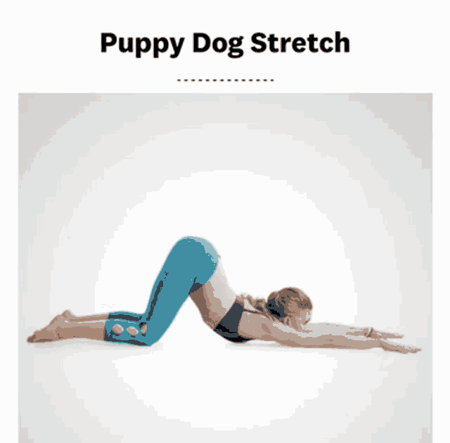 a woman is doing a puppy dog stretch on her back