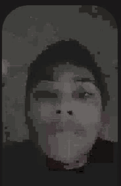 a close up of a person 's face in a pixelated image