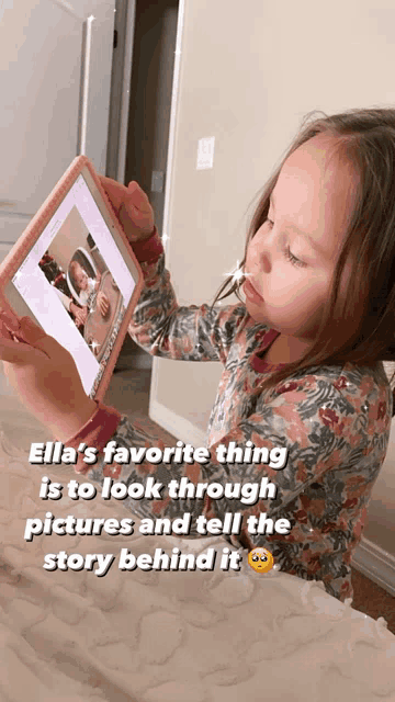 a little girl is looking at a tablet with the caption " ella 's favorite thing is to look through pictures and tell the story behind it