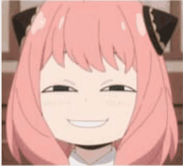 a close up of a pink haired anime girl smiling with a cat ear .