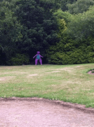 a purple cartoon character is standing in the middle of a field