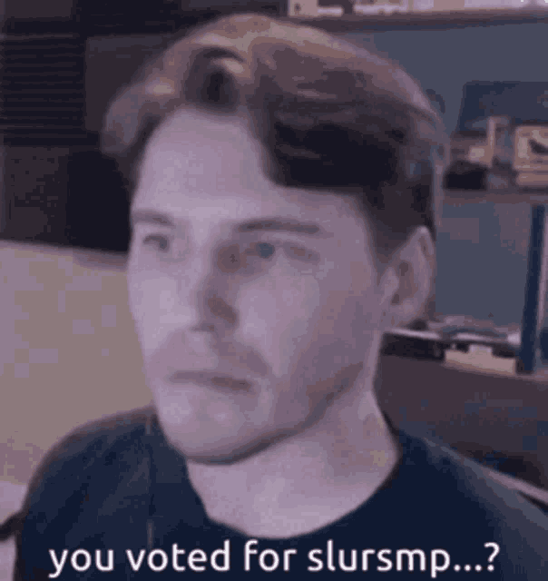 a man in a black shirt is saying you voted for slursmp