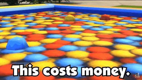 a pool of colorful balls with the words this costs money