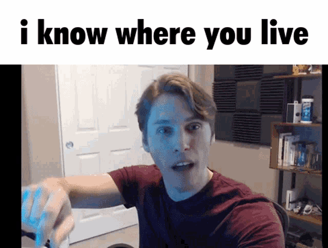 a man in a red shirt is pointing at the camera with the words " i know where you live " below him