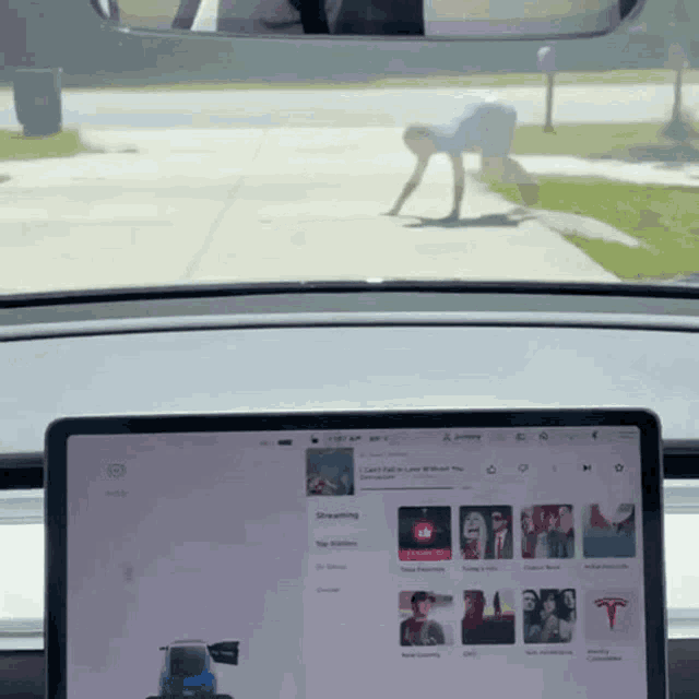 a tesla model 3 dashboard with a screen that says streaming