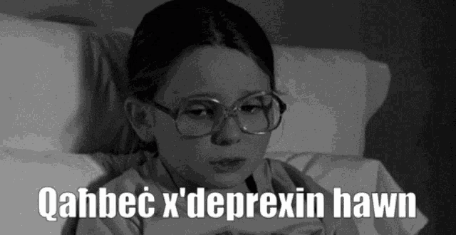 a black and white photo of a girl with glasses and the words " qahbec x ' deprexin hawn "