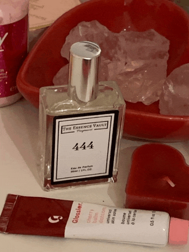 a bottle of the essence vault 444 perfume