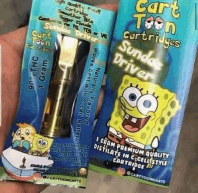 a person is holding a spongebob cartridge and a spongebob cartridge .