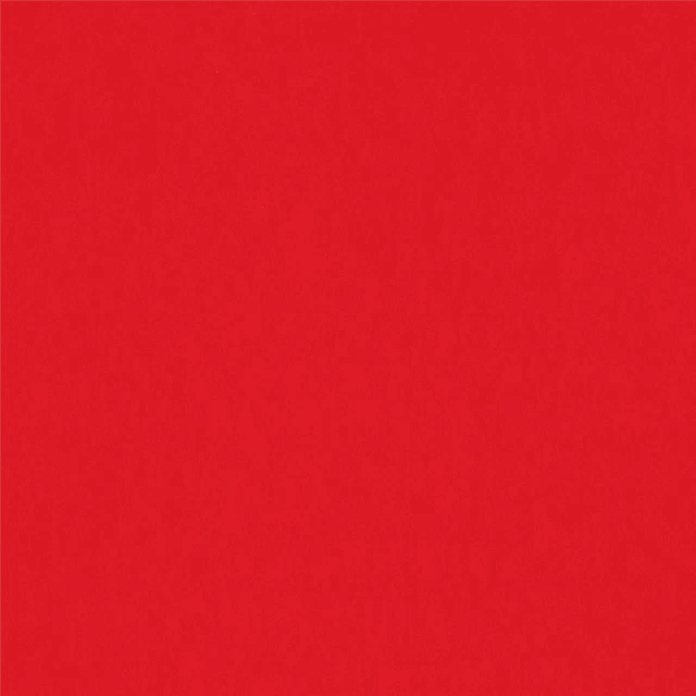 a close up of a red background with a plain red texture .