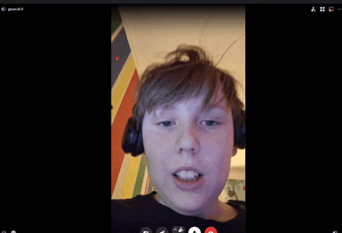 a boy wearing headphones is on a video call with the name general47