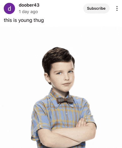 a young boy in a plaid shirt and bow tie is standing with his arms crossed in front of a white background