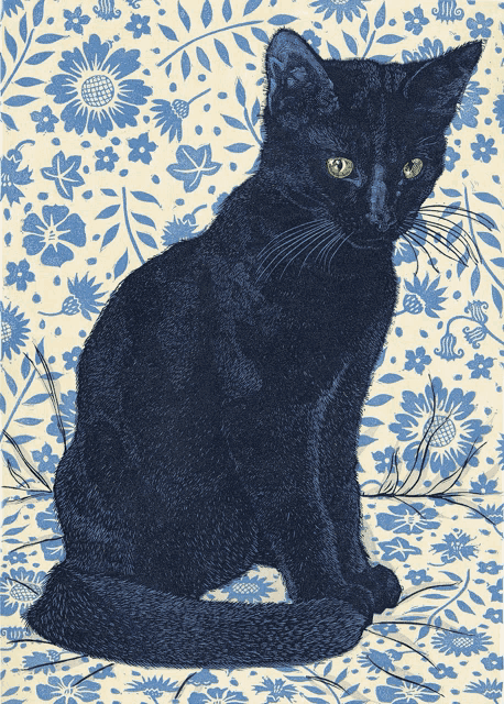 a black cat with green eyes sits on a floral background