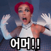 a woman with red hair is wearing white gloves and making a funny face .