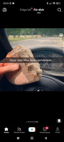 a person is holding a piece of bread in front of a car dashboard with a caption that says muss über alles bissi nachdenken