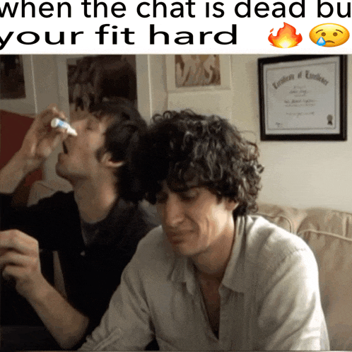 two men sitting on a couch with a caption that says when the chat is dead bu your fit hard