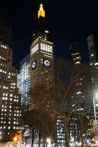 a tall building with a clock on top of it that says ' aaa ' on it