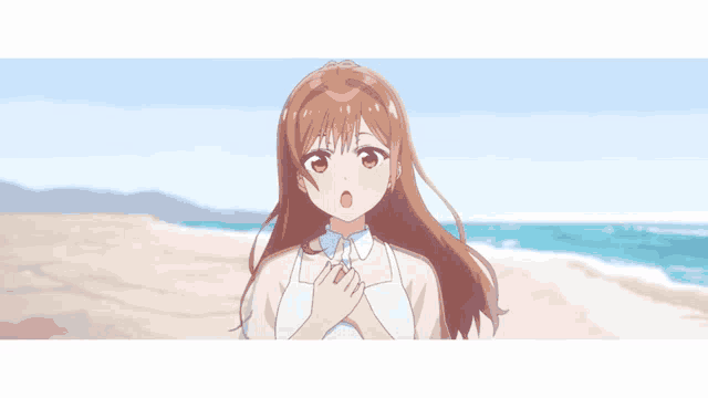 a girl with brown hair is standing on a beach with her hands on her chest