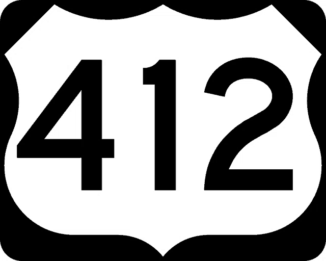 a black and white highway sign with the number 412 on it