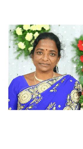 a woman in a blue and gold sari is standing in front of flowers and looking at the camera .