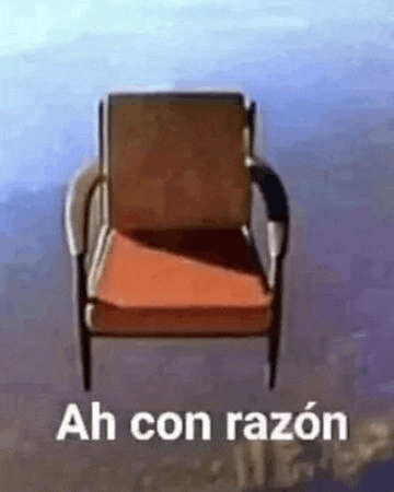 a chair is floating in the air with the words ah con razon written on it .