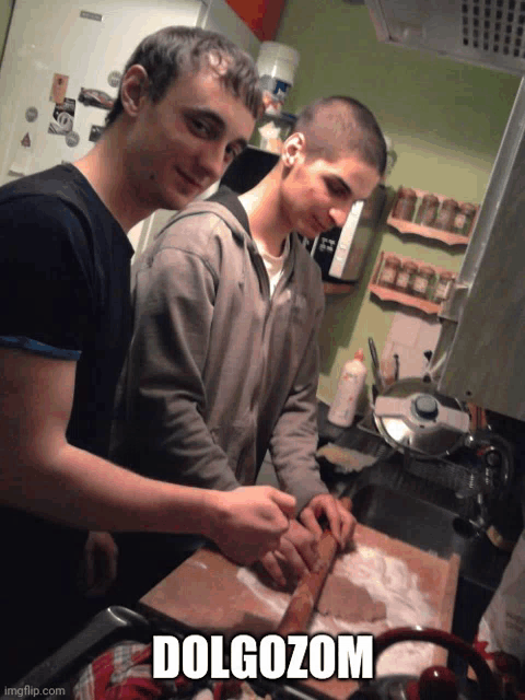 two young men cooking in a kitchen with the caption dolgozom on the bottom