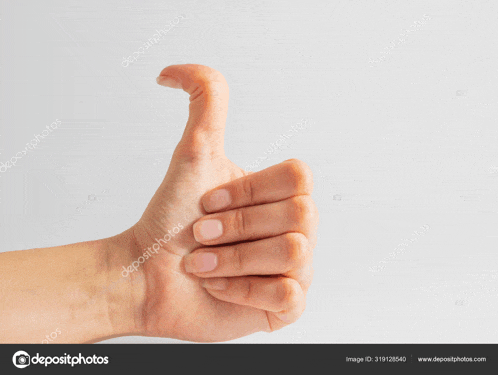 a woman 's hand giving a thumbs up on a white background