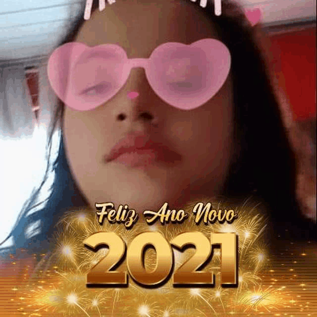 a girl wearing pink heart shaped sunglasses with the year 2021 written on it .