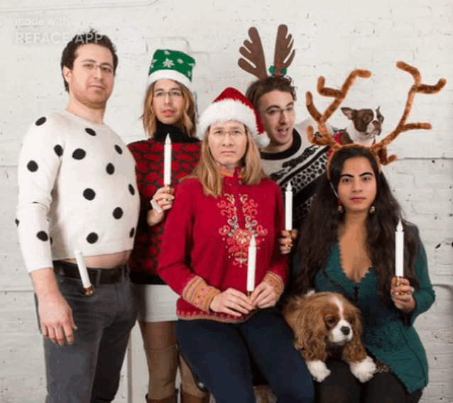 a group of people are posing for a christmas photo