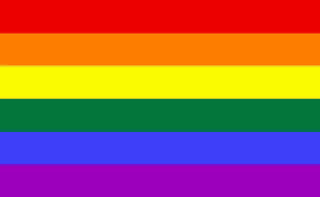 a close up of a rainbow flag on a white background