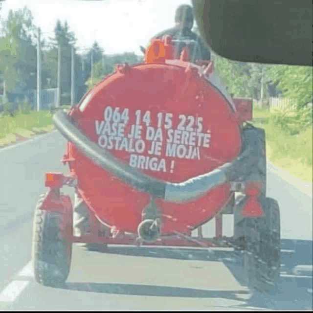 a red tanker with the number 064 14 15 225 on the side