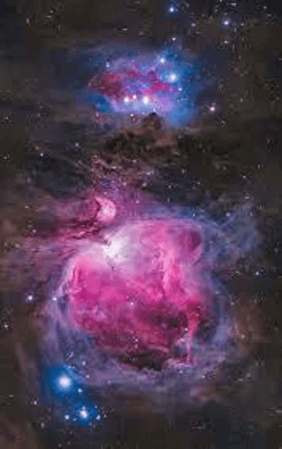 a purple and blue nebula in the night sky