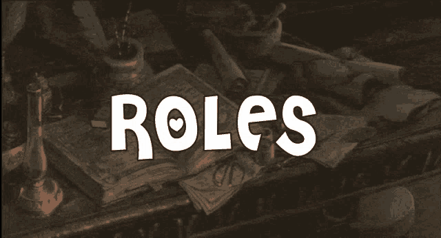 the word roles is on a table with various items on it