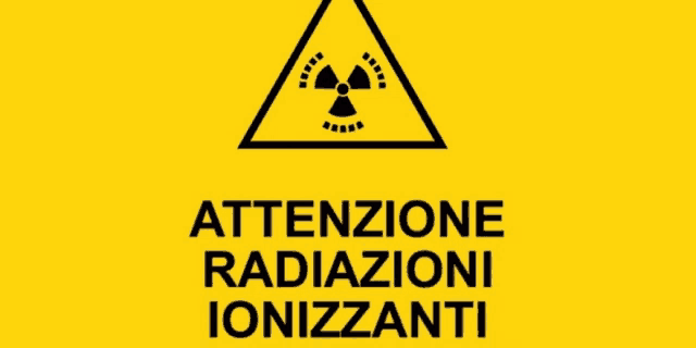 a yellow sign that says attenzione radiazioni ionizzanti in black letters