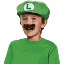 a young boy wearing a green shirt and a green hat with a l on it and a fake mustache .