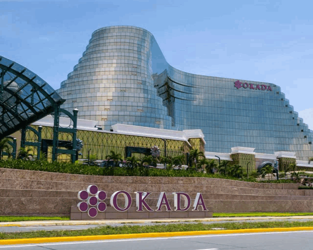 a large building with the word okada written on it