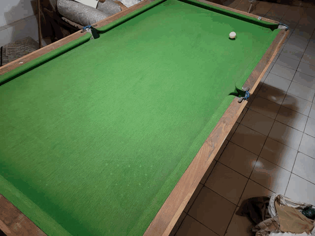 a pool table with a ball on the table