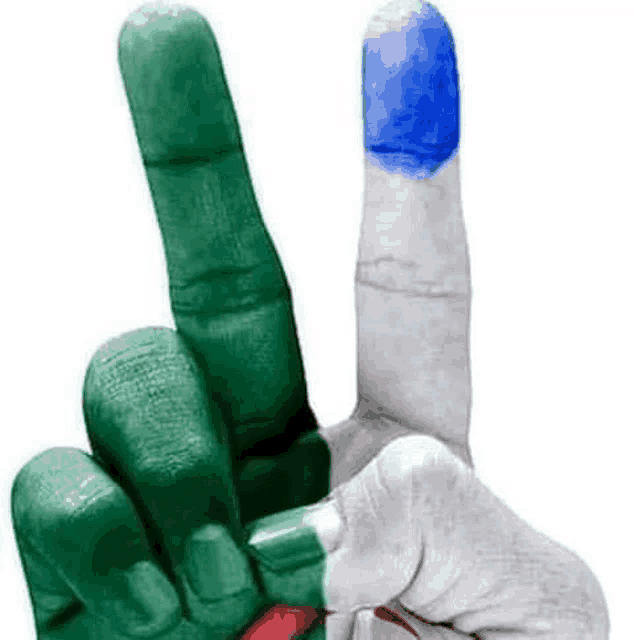 a hand with green and white fingers and a blue finger painted in the colors of the flag is making a peace sign .