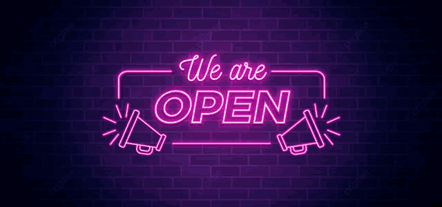 a neon sign that says we are open on a dark brick wall