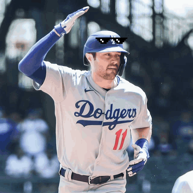 a dodgers baseball player wearing sunglasses and a number 11 jersey