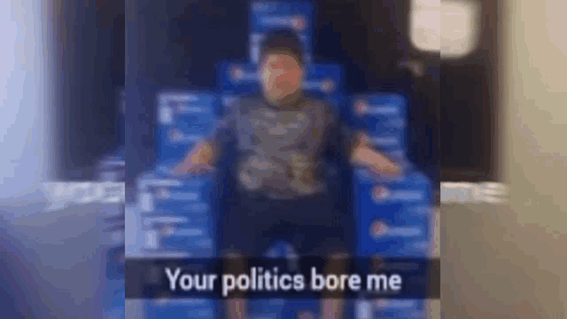 a boy is standing in front of a stack of pepsi boxes and says your politics bore me