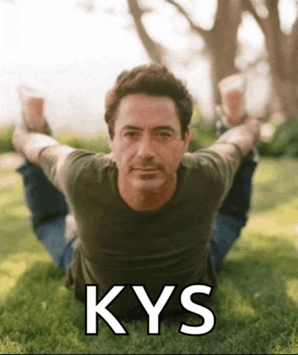 a picture of a man doing a yoga pose with the word kys written below him