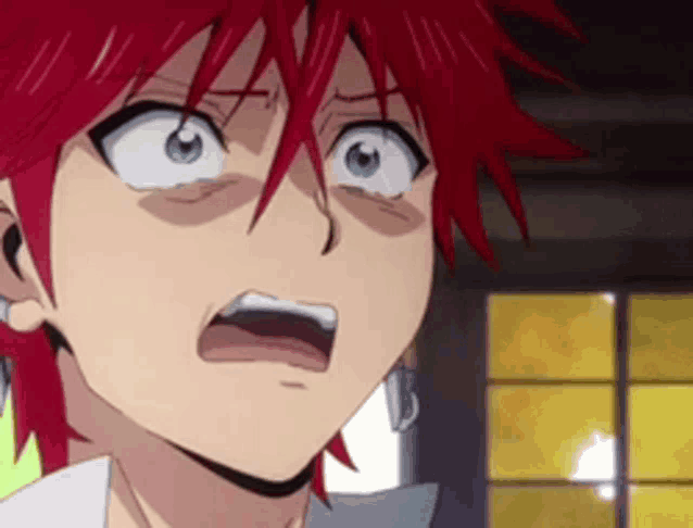 a close up of a cartoon character with red hair and blue eyes making a surprised face .