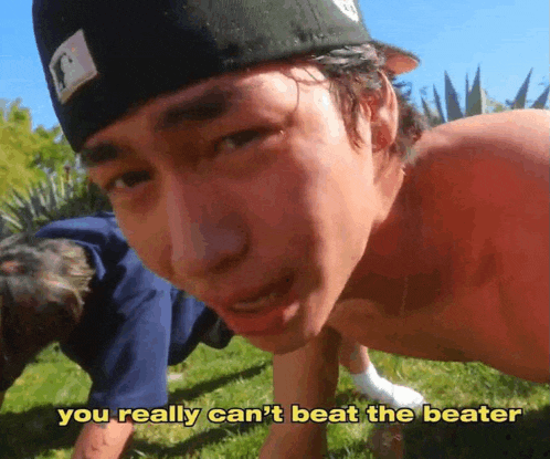 a shirtless man is doing push ups with the words " you really can 't beat the beater " above him