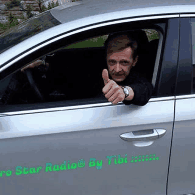 a man giving a thumbs up in a car with the words pro star radio by tibi on the side