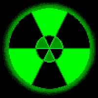 a green and black nuclear symbol is glowing in the dark on a black background .