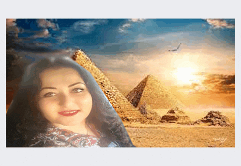 a woman is standing in front of a pyramid with the sun behind her