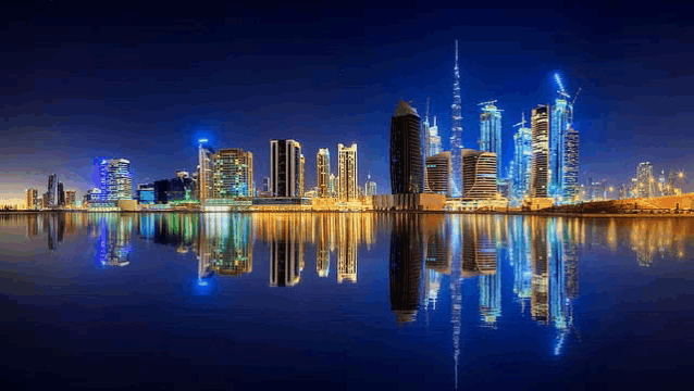 the skyline of a city is reflected in the water